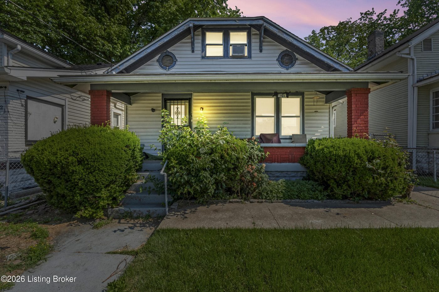 Exterior of 4019 W Muhammad Ali Blvd, Louisville KY — front porch at dusk